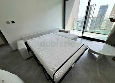 Light beige fabric convertible sofa bed with mattress - good condition