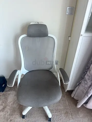 Ergonomic swivel office chair with headrest - used