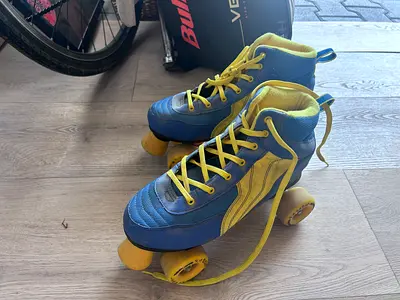 Used blue and yellow quad roller skates - size not marked size 42