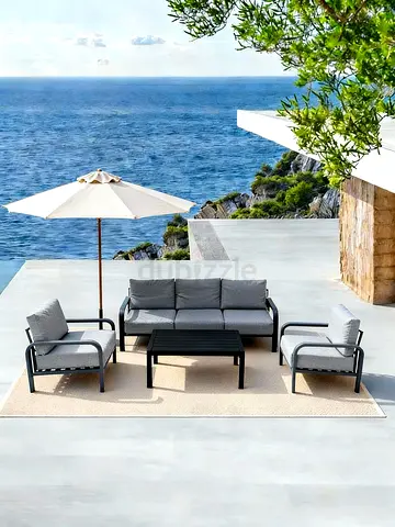 Outdoor 4-piece patio sofa set with cushions and coffee table