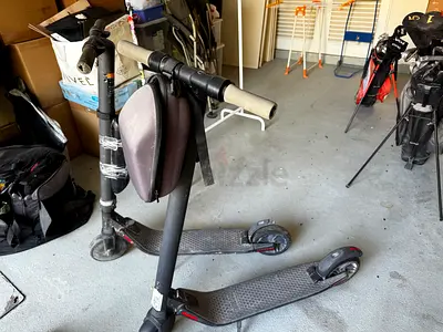 Pair of used adult kick scooters — to be used for parts for commuting scooters nine bot