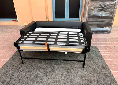 Compact black leather sofa bed with pull-out mattress good condition)