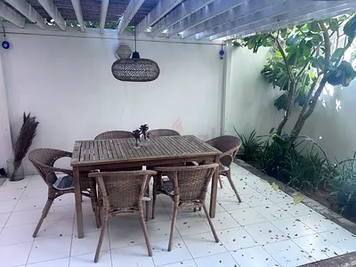 Outdoor wooden dining table with 6 wicker chairs - weathered rattan set