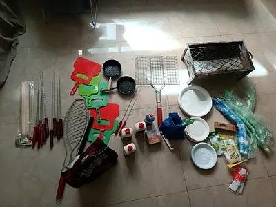 Portable charcoal grill with skewers, pans and accessories - used